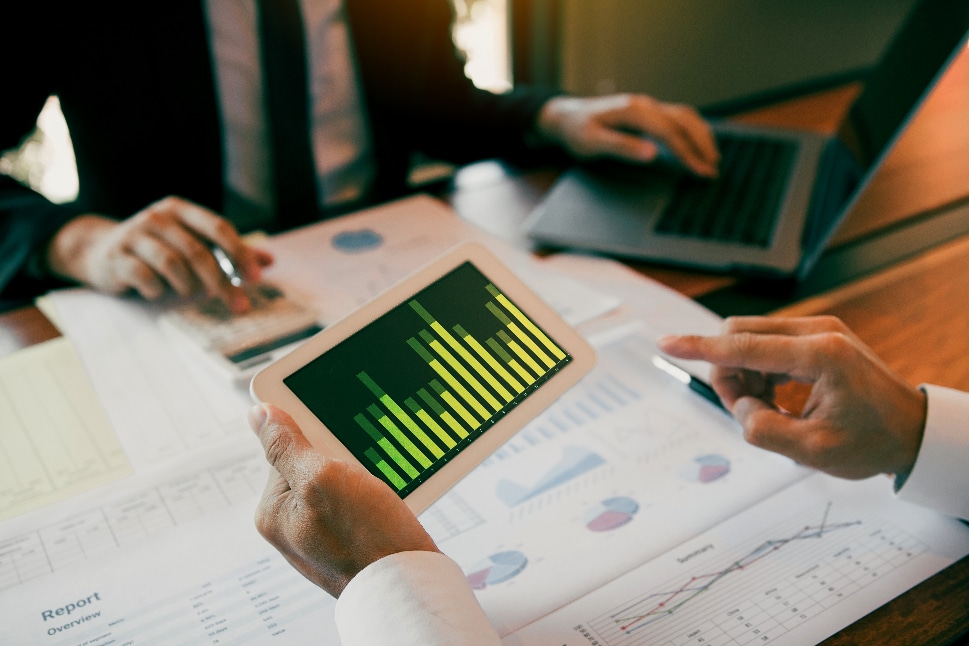 Businessmen looking at graph while analyzing the company budget 