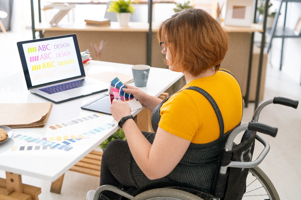 Woman using creative design with font and color for marketing campaign